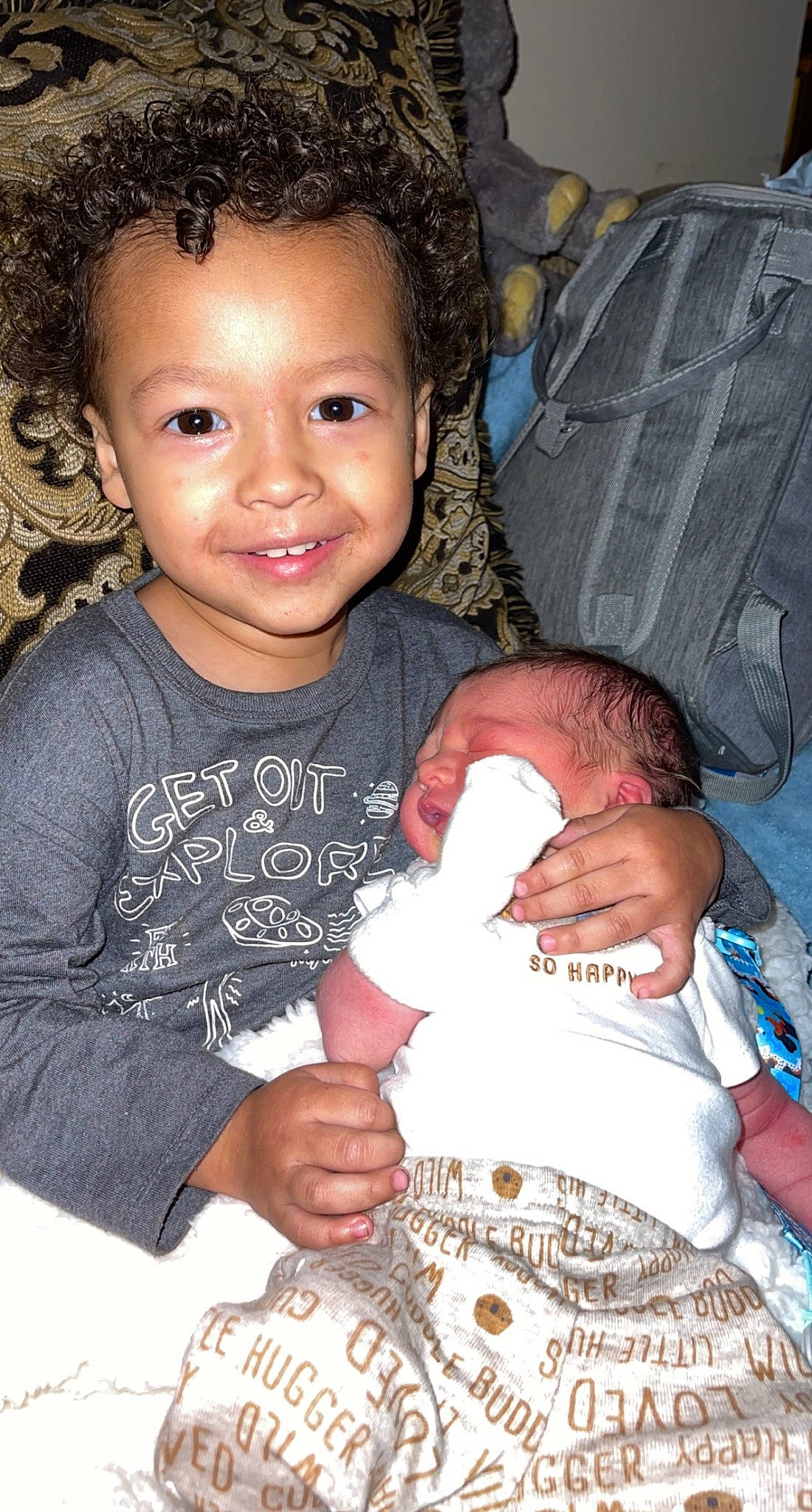 Zaiden is registered to the contest to win money with this photo: arm, baby_toddler_clothing, beauty, blue, cheek, child, comfort, eye, facial_expression, finger, flash_photography, gesture, happy, head, human, iris, joy, organ, person, skin