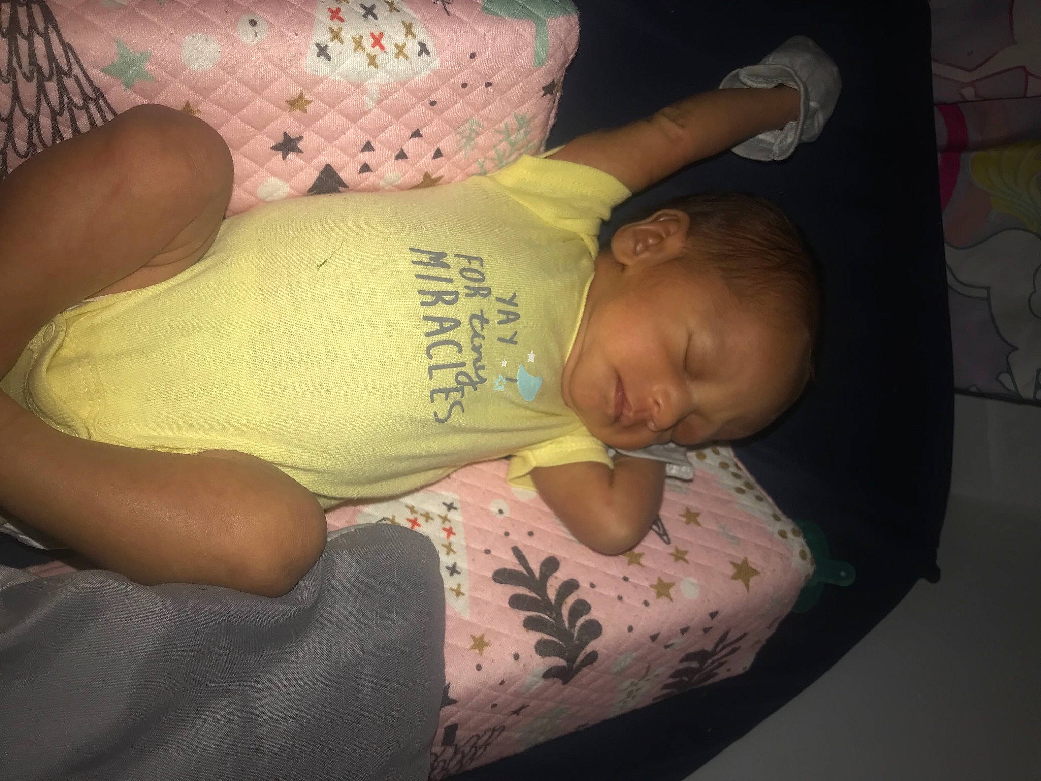 Hazelynn is registered to the contest to win money with this photo: abdomen, baby, cheek, chest, comfort, elbow, finger, happy, human_leg, knee, leg, mouth, pattern, person, skin, sleeve, textile, thigh, thumb, toddler