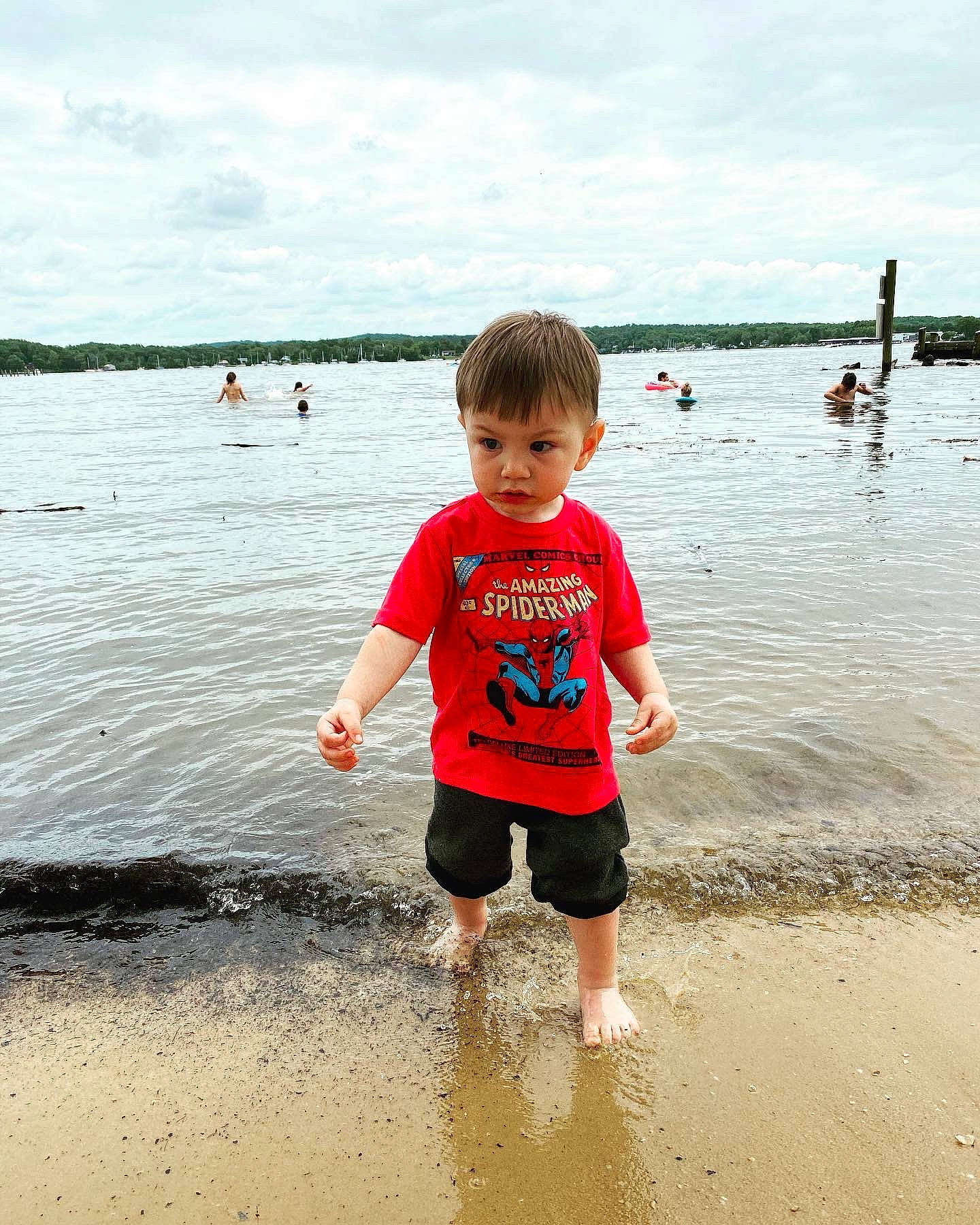 Malaki joined the competition — help win amazing prizes! beach, child, cloud, fun, happy, human, lake, leisure, mammal, natural_environment, people_in_nature, people_on_beach, person, recreation, shorts, sky, standing, toddler, vertebrate, water