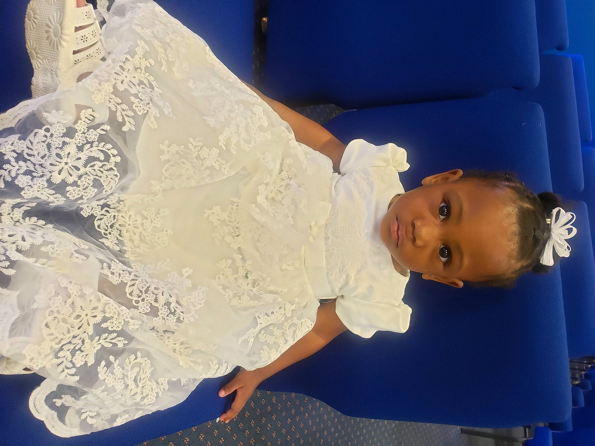 Azriel is registered to the contest to win money with this photo: baby, baby_toddler_clothing, blue, bridal_accessory, bridal_clothing, bridal_party_dress, bridal_veil, bride, dress, embellishment, fashion_design, gown, happy, human_body, joint, person, product, sleeve, textile, toddler