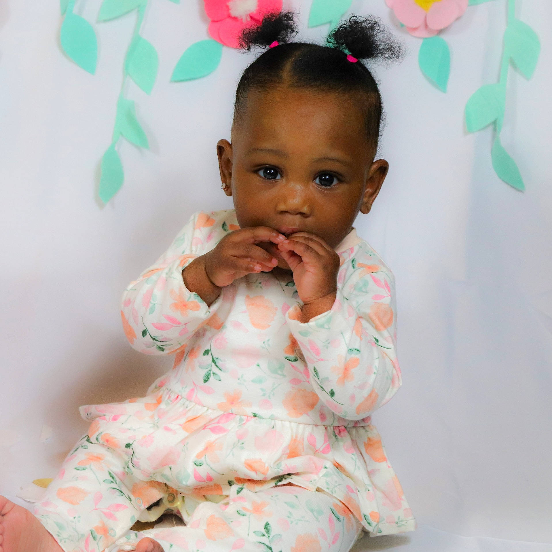 Azriel is registered to the contest to win money with this photo: arm, baby, baby_toddler_clothing, cheek, child, dress, eyelash, face, gesture, green, happy, head, jewellery, neck, nose, person, pink, shoulder, skin, sleeve