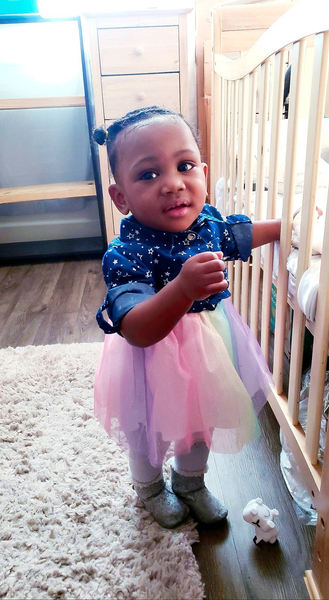 Azriel joined the competition — help win amazing prizes! azure, baby, baby_toddler_clothing, dress, electric_blue, flooring, fun, happy, iris, magenta, person, pink, purple, sitting, skin, sleeve, smile, sneakers, standing, toddler