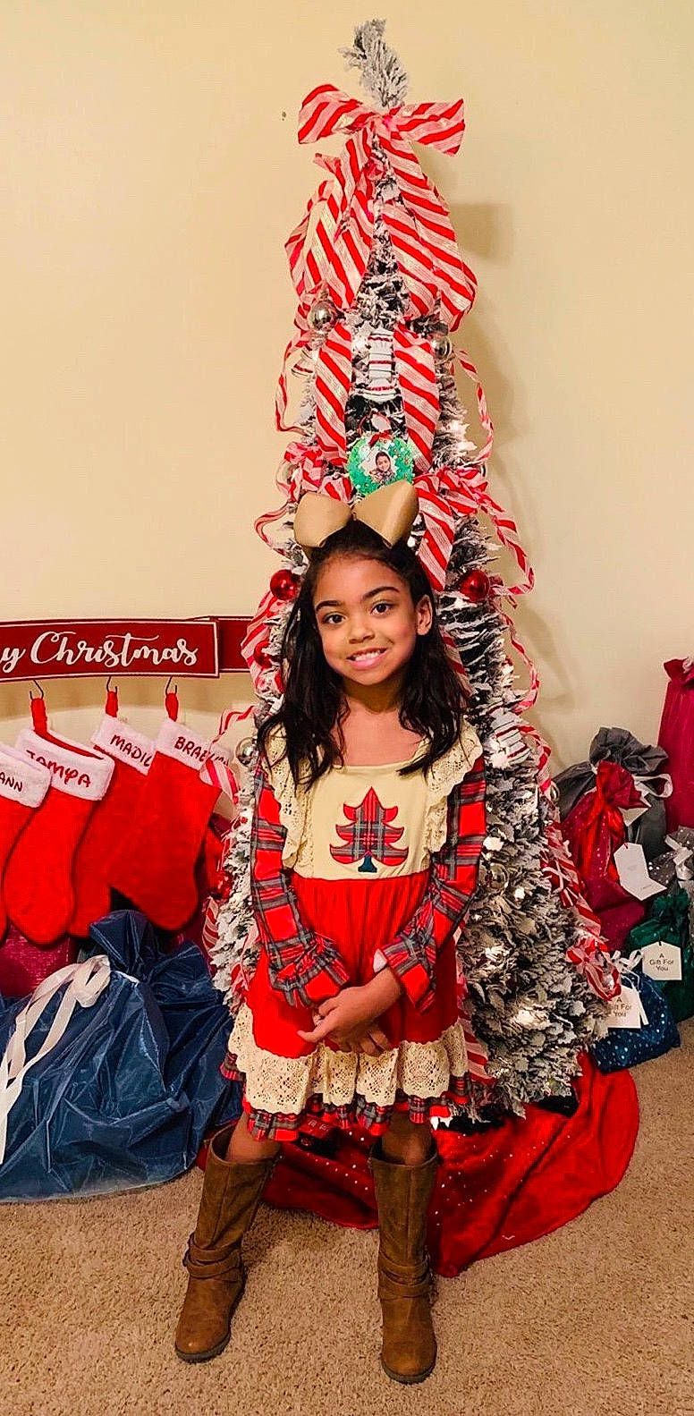 Madilyn is registered to the contest to win money with this photo: costume, event, fashion_accessory, hairstyle, joy, long_hair, person, red, tradition