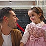 man, child, girl, smile, dress, pink, bow, rope, interaction, stairs, marble, indoor, happy, family, people, casual_clothing, glass, railing, portrait, playful