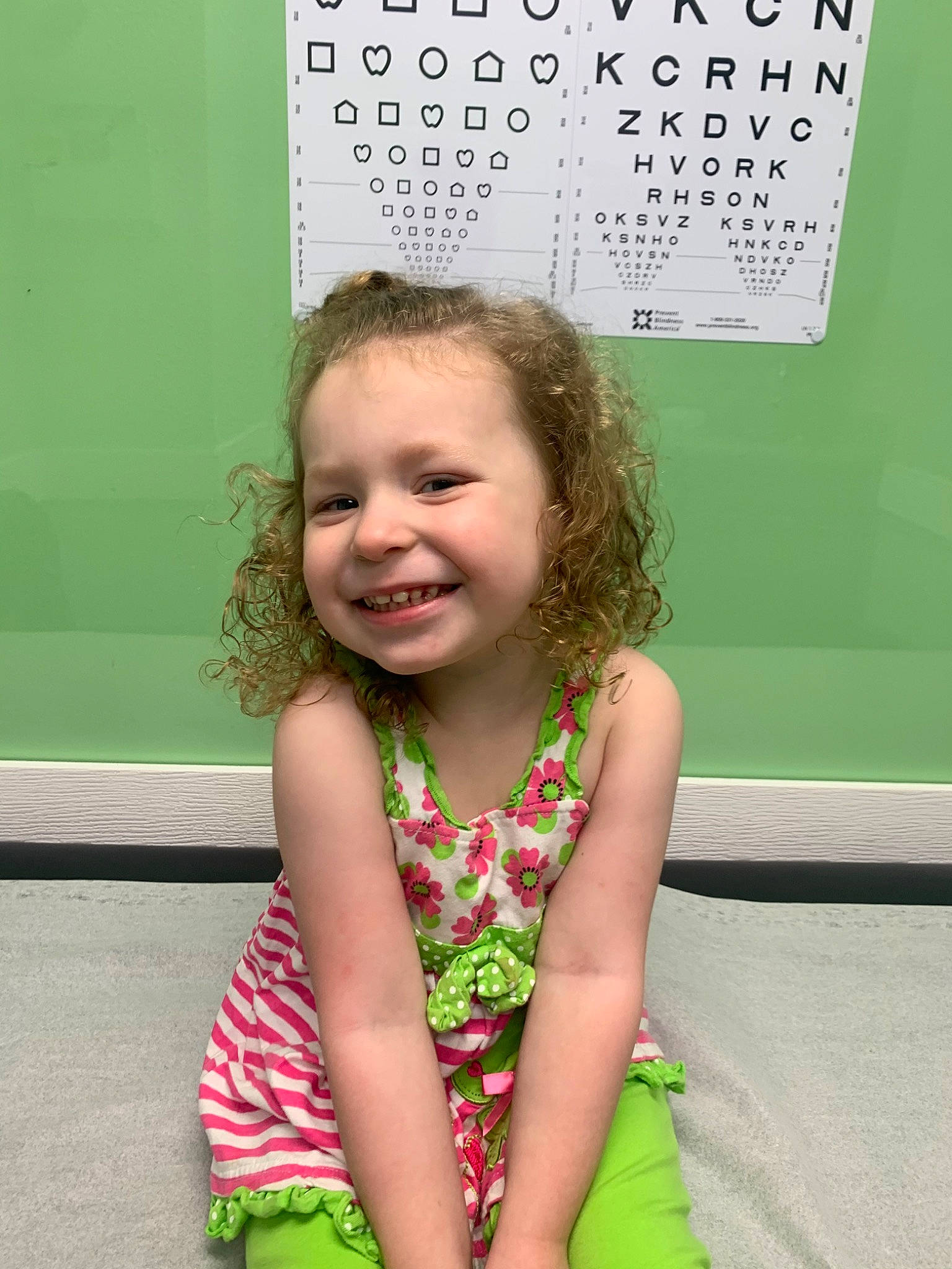 Gabriella is registered to the contest to win money with this photo: baby_toddler_clothing, child, chin, dress, eye, face, fun, green, hairstyle, happy, head, iris, joy, person, photograph, skin, sleeve, smile, snapshot, standing