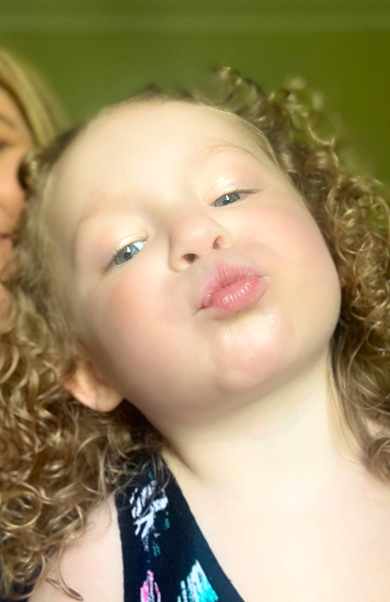 Gabriella is registered to the contest to win money with this photo: black_hair, cheek, chin, ear, eye, eyebrow, eyelash, forehead, gesture, happy, iris, jaw, lip, mouth, neck, nose, person, ringlet, shoulder, skin