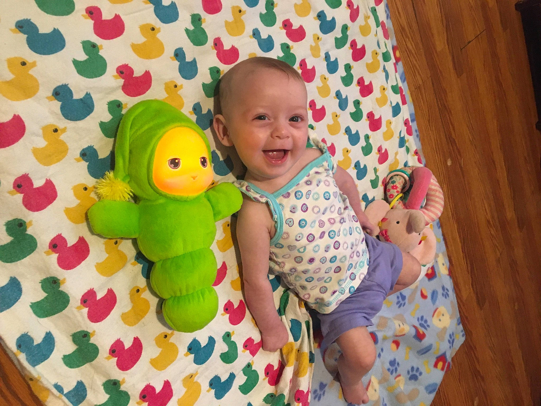 Jada is registered to the contest to win money with this photo: baby, baby_playing_with_toys, baby_products, baby_toddler_clothing, child, fun, happy, head, leisure, pattern, person, pink, product, skin, smile, stuffed_toy, t_shirt, textile, toddler, toy