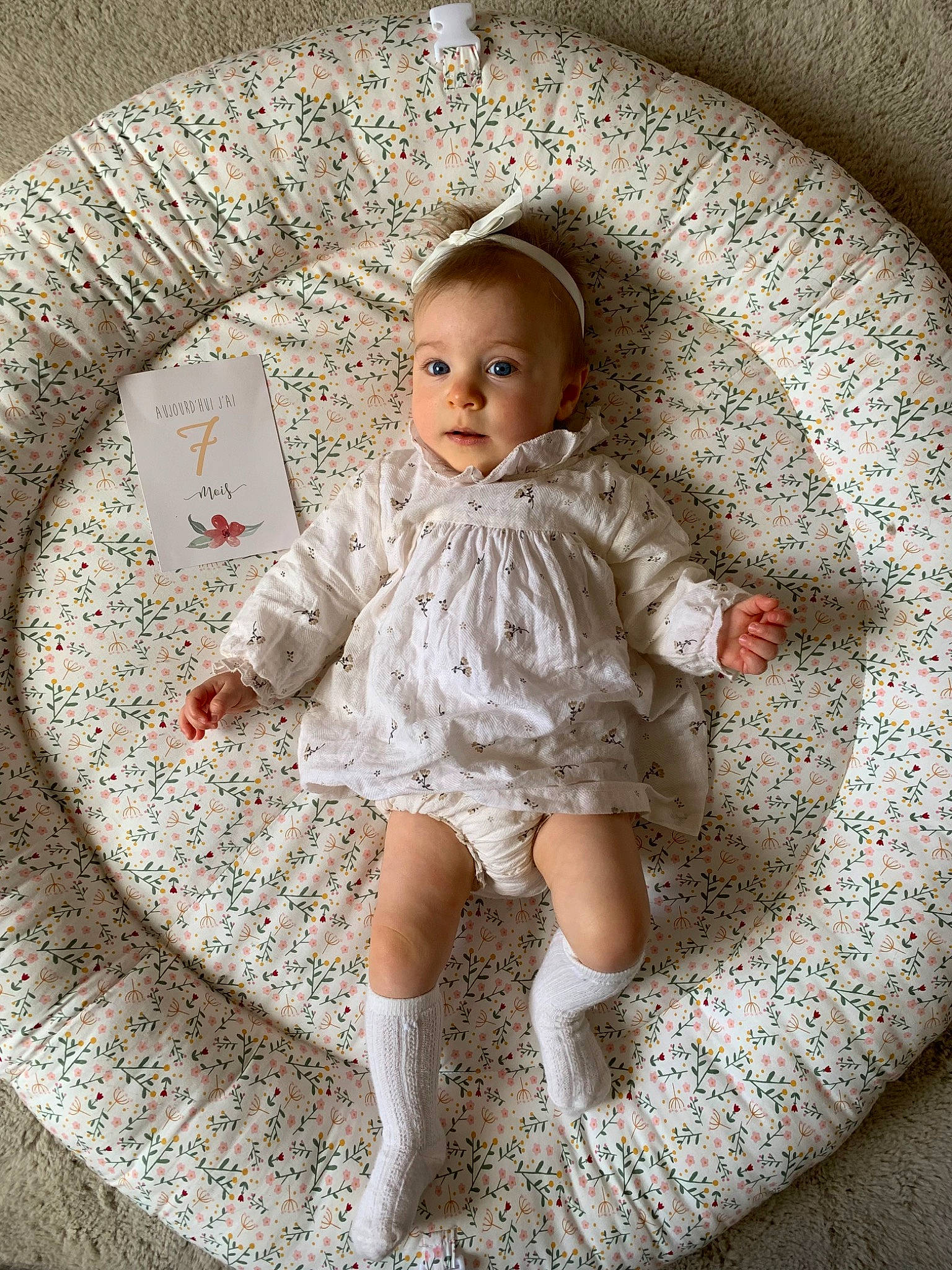 Maryjane participe au concours pour gagner de l'argent avec cette photo : arm, art, baby, baby_toddler_clothing, child, circle, day_dress, dress, embellishment, fashion_accessory, human_body, linens, pattern, person, ruffle, sitting, sleeve, sock, textile, toddler