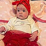 Oaklynn is registered to the contest to win money with this photo: baby, infant, red_headband, red_tutu, red_pants, white_onesie, blanket, pink_blanket, heart_pattern, indoors, cute, child, face, head, clothing, soft_texture, portrait, sitting, young_child, expression