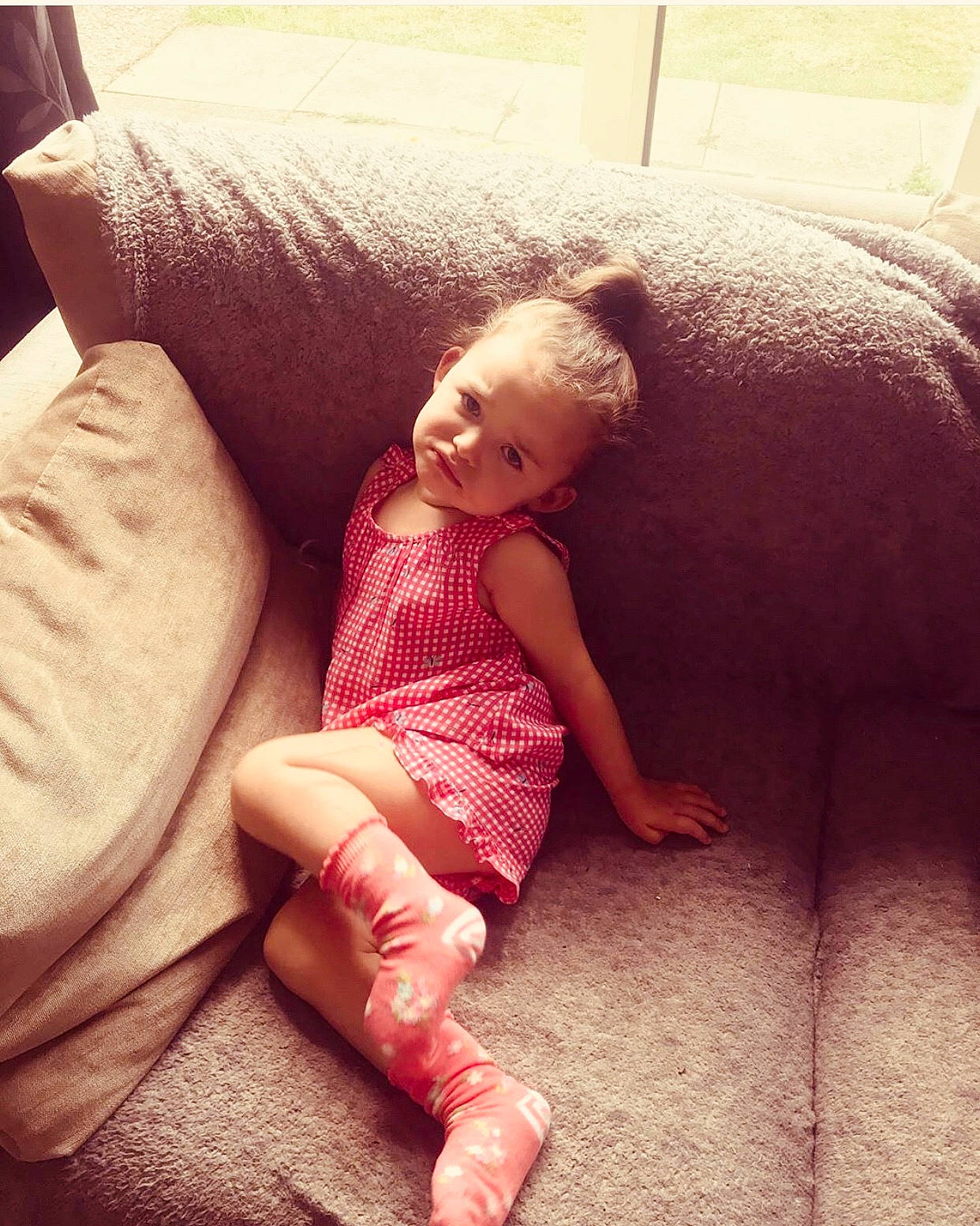 Isla-rose is registered to the contest to win money with this photo: arm, baby, beauty, cheek, child, eye, face, finger, hand, head, human_leg, joint, leg, nose, person, pink, shoulder, sitting, skin, smile