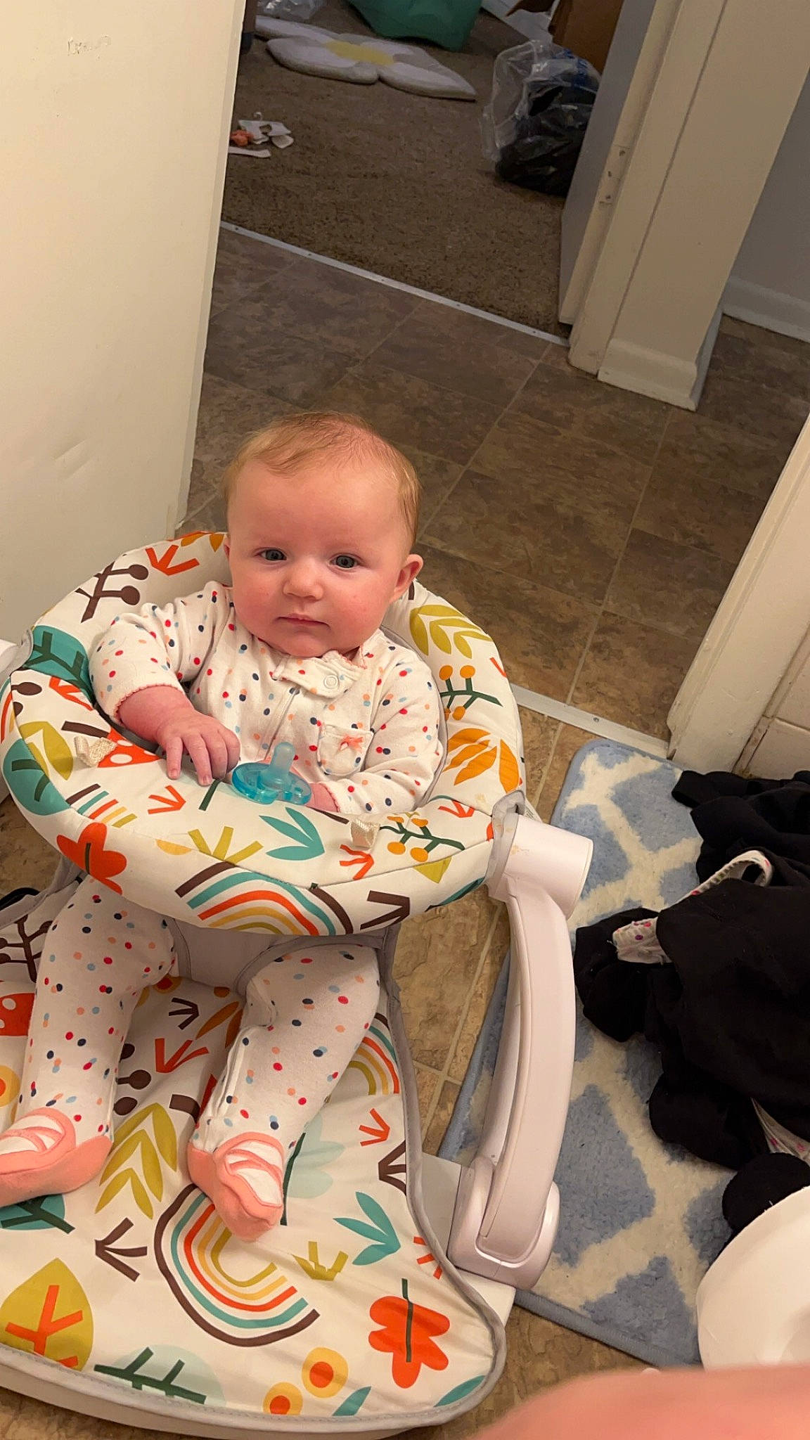 Payton is registered to the contest to win money with this photo: baby, baby_products, baby_toddler_clothing, carmine, cheek, child, comfort, door, floor, flooring, foot, human_body, human_leg, knee, lap, person, room, sitting, skin, thigh
