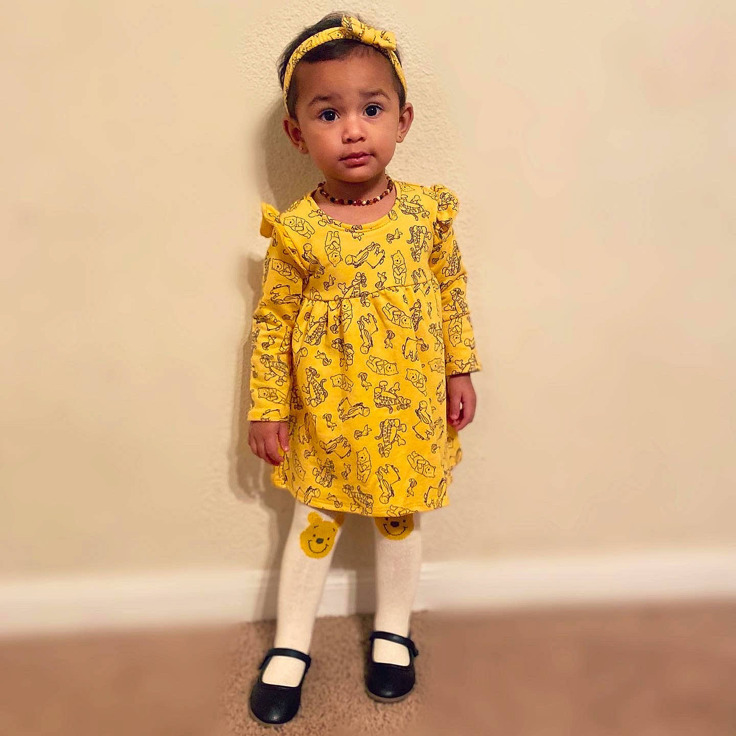 Gianna is registered to the contest to win money with this photo: arm, baby_toddler_clothing, child, day_dress, doll, dress, eye, face, facial_expression, fashion_design, hair, hand, head, human_body, leg, one_piece_garment, pattern, person, sleeve, toddler