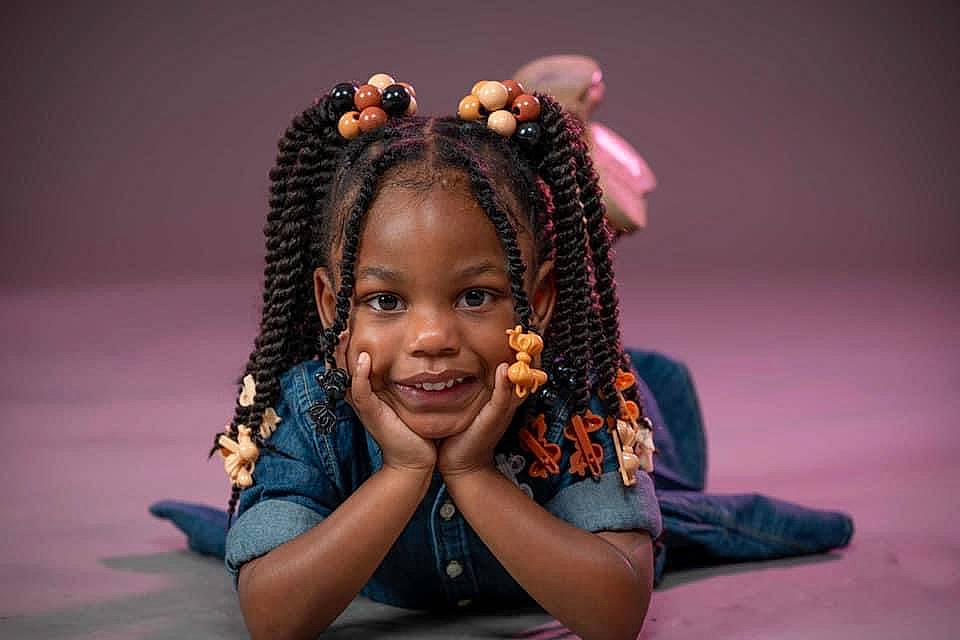 Harmony is registered to the contest to win money with this photo: audio_equipment, black_hair, child, cornrows, dreadlocks, entertainment, event, eye, eyelash, fashion_accessory, flash_photography, fun, hair_accessory, happy, jewellery, joy, magenta, necklace, performing_arts, person