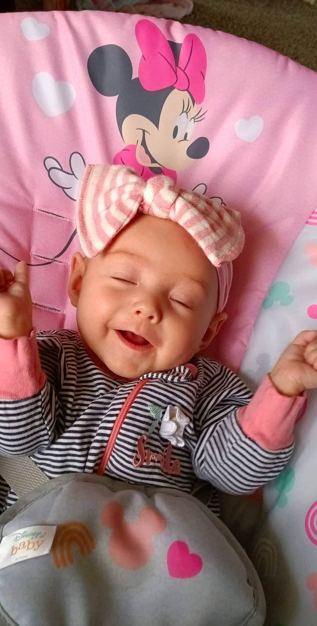 Haven is registered to the contest to win money with this photo: arm, baby, baby_toddler_clothing, cap, cheek, eye, face, facial_expression, finger, gesture, hand, happy, headwear, lip, nose, person, pink, skin, sleeve, smile