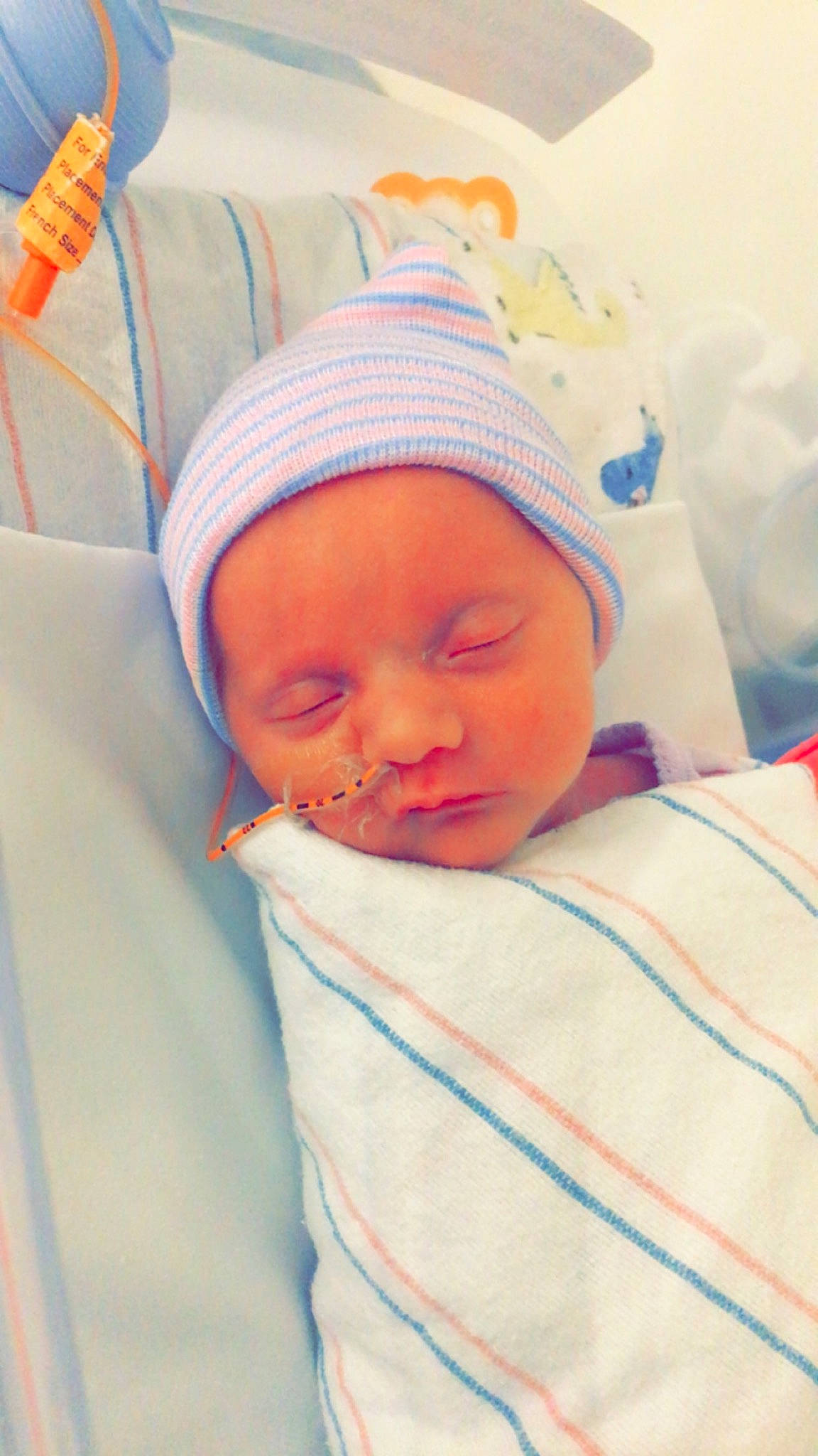 Spencer joined the competition — help win amazing prizes! baby, baby_products, baby_sleeping, baby_toddler_clothing, beanie, bedtime, blanket, cheek, child, comfort, hat, headwear, linens, magenta, nap, orange, person, room, skin, sleep