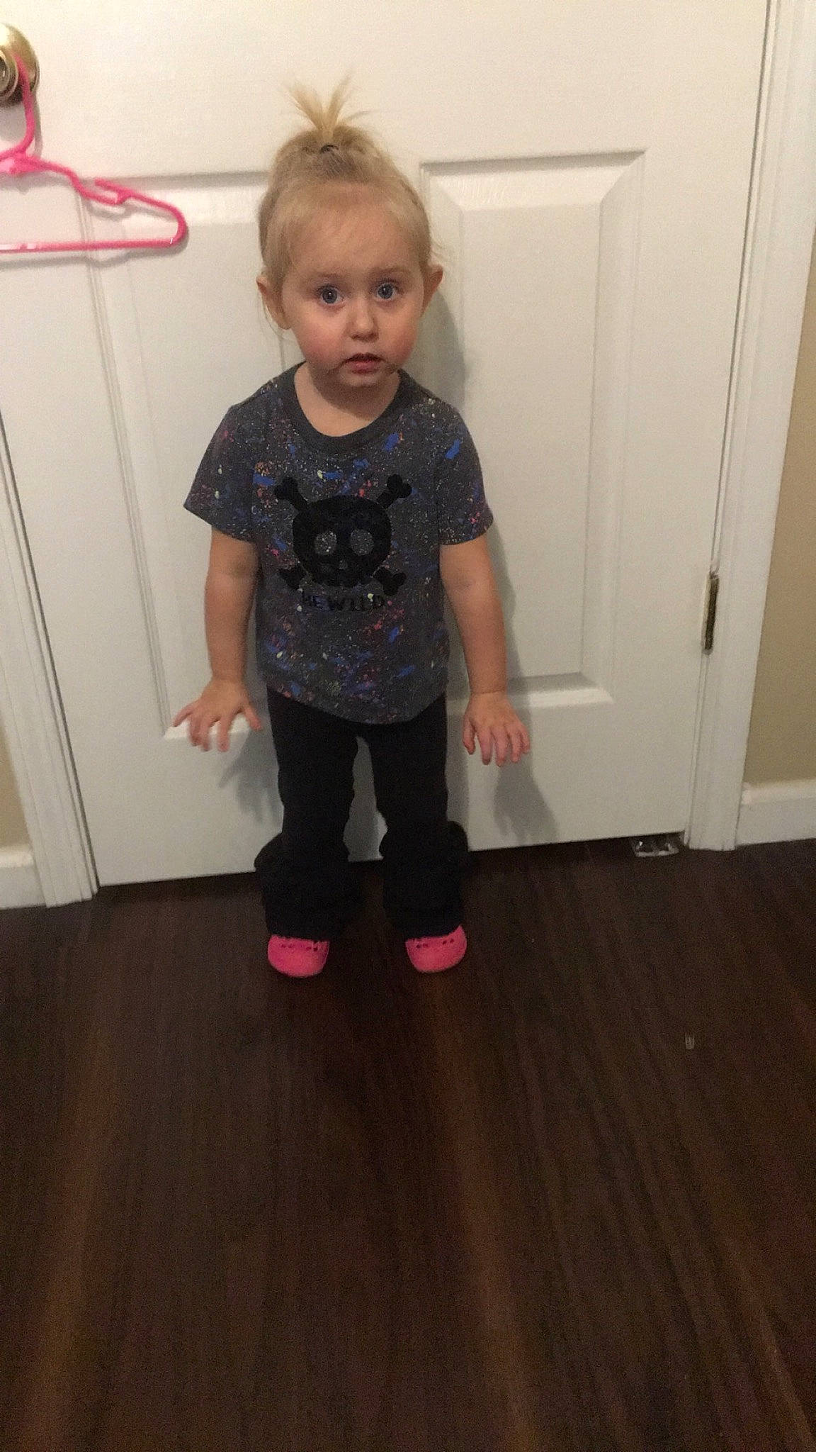 Thea joined the competition — help win amazing prizes! baby_toddler_clothing, child, door, floor, flooring, hair, hardwood, head, knee, laminate_flooring, leg, magenta, pattern, person, sleeve, surprise, t_shirt, toddler, varnish, wood