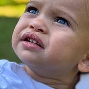 Isabella is registered to the contest to win money with this photo: child, toddler, face, blue_eyes, curious, expression, closeup, portrait, skin, lips, white_shirt, outdoor, background_blur, young, innocence, person, head, eyelashes, nose, cheeks