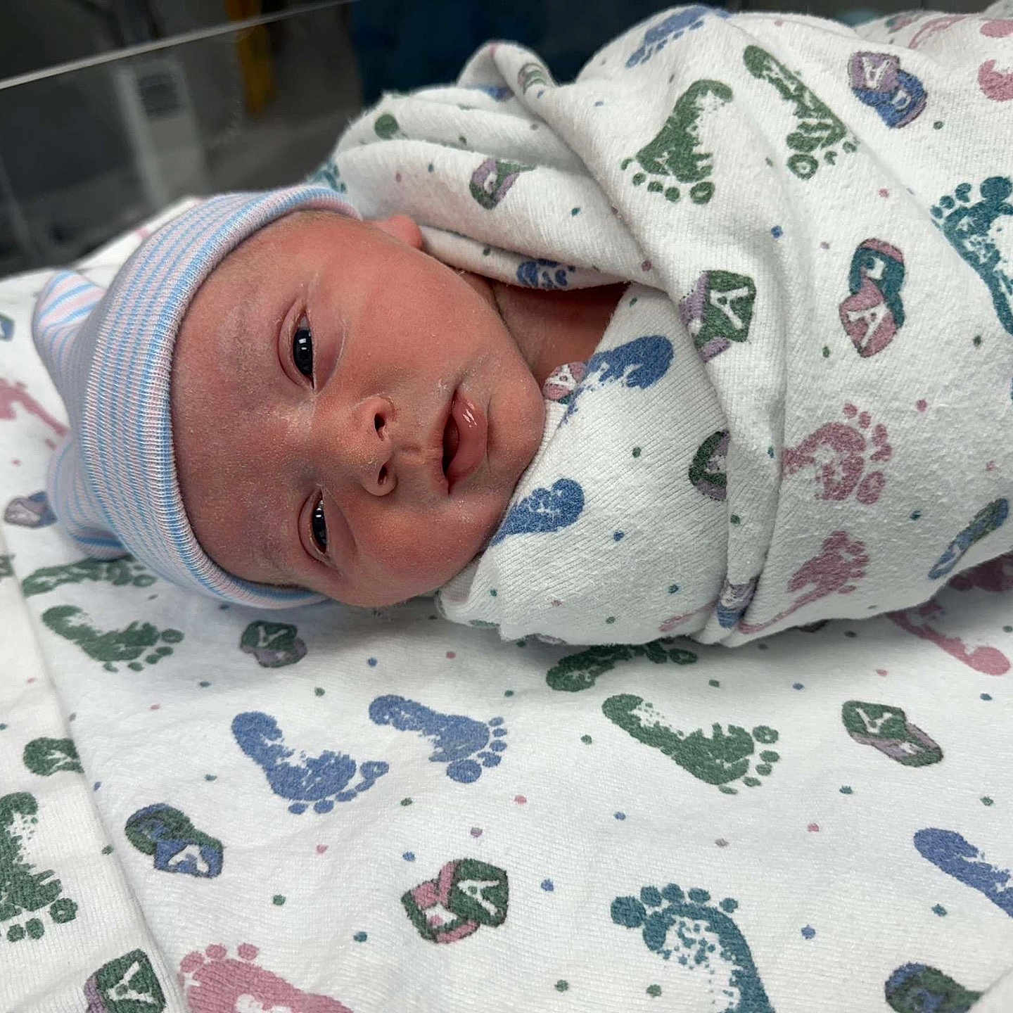 Jacob is registered to the contest to win money with this photo: architecture, baby, bed, blanket, building, childbirth, clothing, crib, face, furniture, happy, hat, head, hospital, newborn, person, photography, portrait, quilt, smile