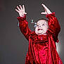 Josie is registered to the contest to win money with this photo: toddler, child, red_dress, velvet, bubbles, smile, happy, hands_up, blue_eyes, portrait, studio, baby, cute, playful, joy, expression, celebration, fashion, long_sleeves, innocence