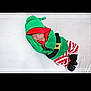 Dallas joined the competition — help win amazing prizes! baby, sleeping, elf_costume, christmas, green_hat, striped_pants, belt, newborn, cute, holiday, soft_surface, infant, costume, red, white, green, black, peaceful, portrait, indoors
