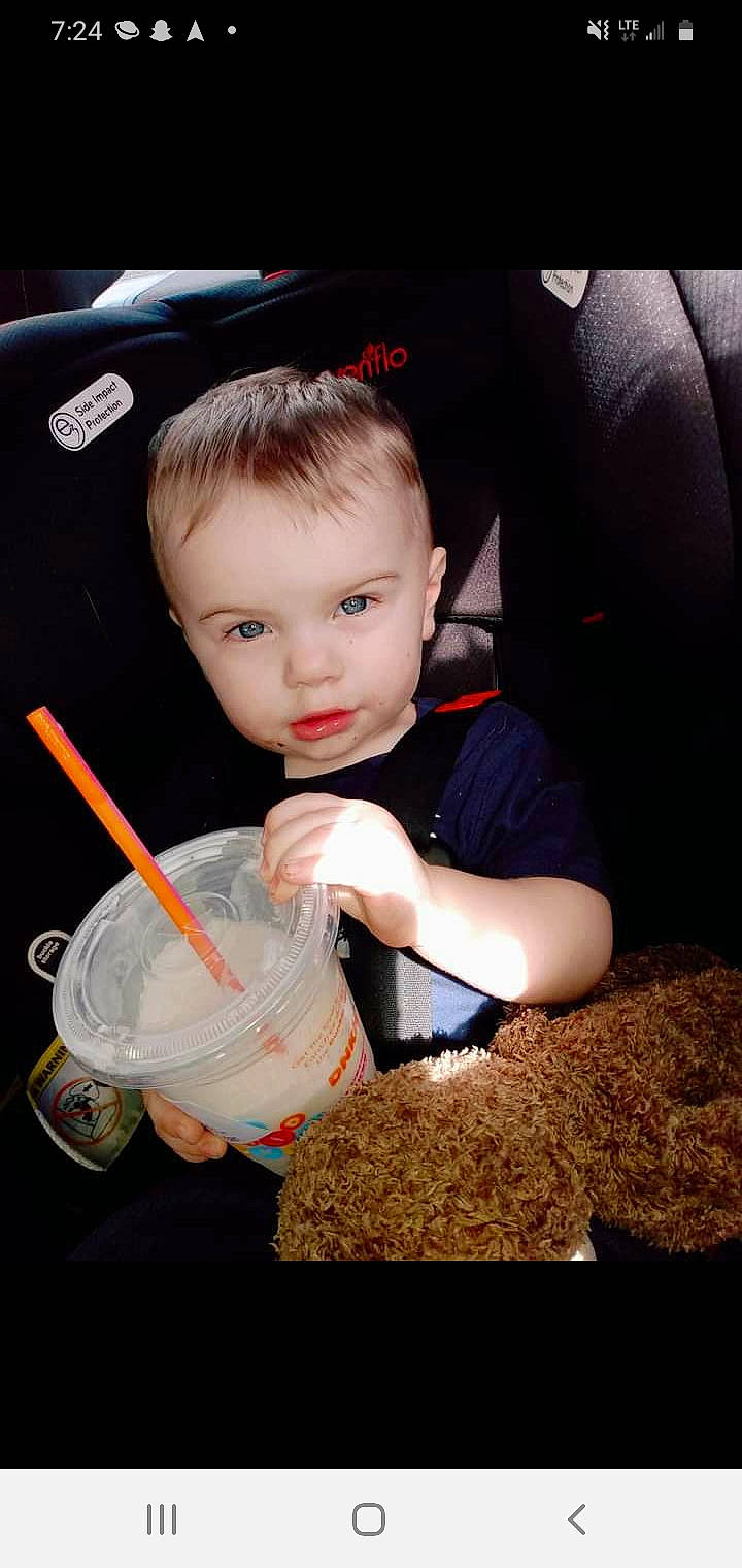 Jayceon is registered to the contest to win money with this photo: bowl, car_seat, child, comfort_food, cuisine, drinking, drinking_straw, eating, flash_photography, food, fun, household_supply, luxury_vehicle, person, photograph, photography, play, sitting, soil, t_shirt