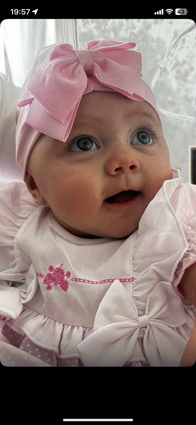 Kyla joined the competition — help win amazing prizes! baby, infant, child, pink_bow, headband, dress, white_clothing, close_up, face, eyes, cute, adorable, portrait, indoors, soft_lighting, expression, young, smiling, happy, baby_girl