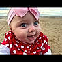 Kyla is registered to the contest to win money with this photo: baby, child, face, blue_eyes, headband, pink_bow, red_clothing, polka_dot, smiling, tongue_out, beach, sand, sky, outdoor, portrait, cute, infant, happy, closeup, person