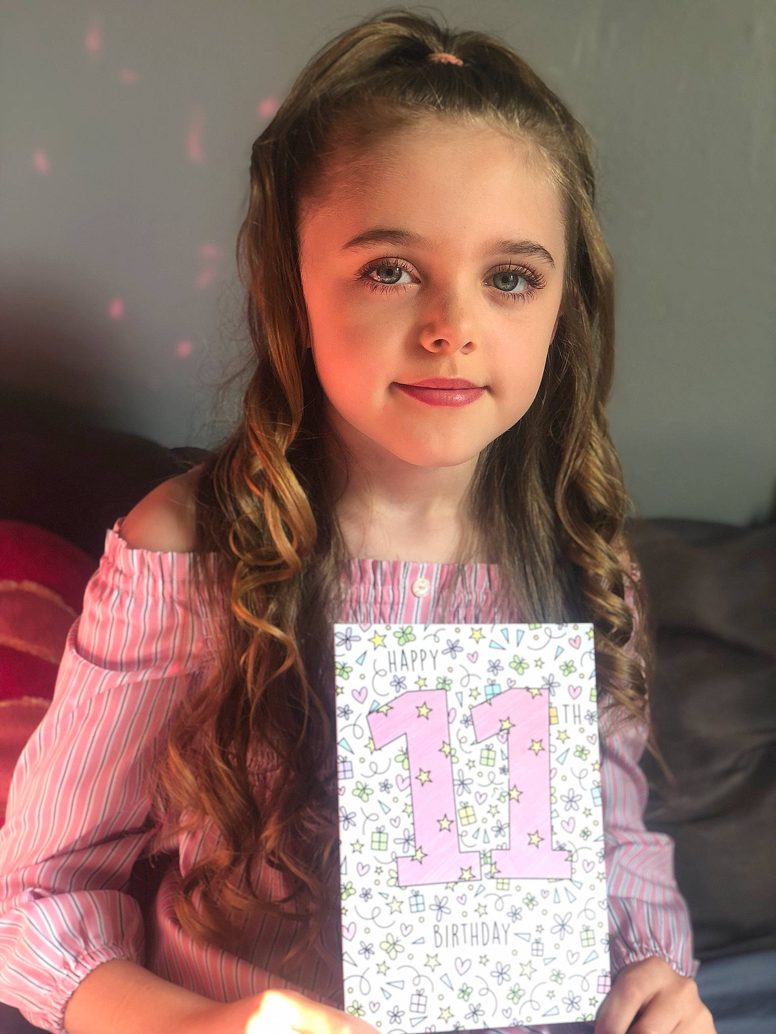 Katie is registered to the contest to win money with this photo: brown_hair, child, child_model, face, forehead, long_hair, person, smile, t_shirt