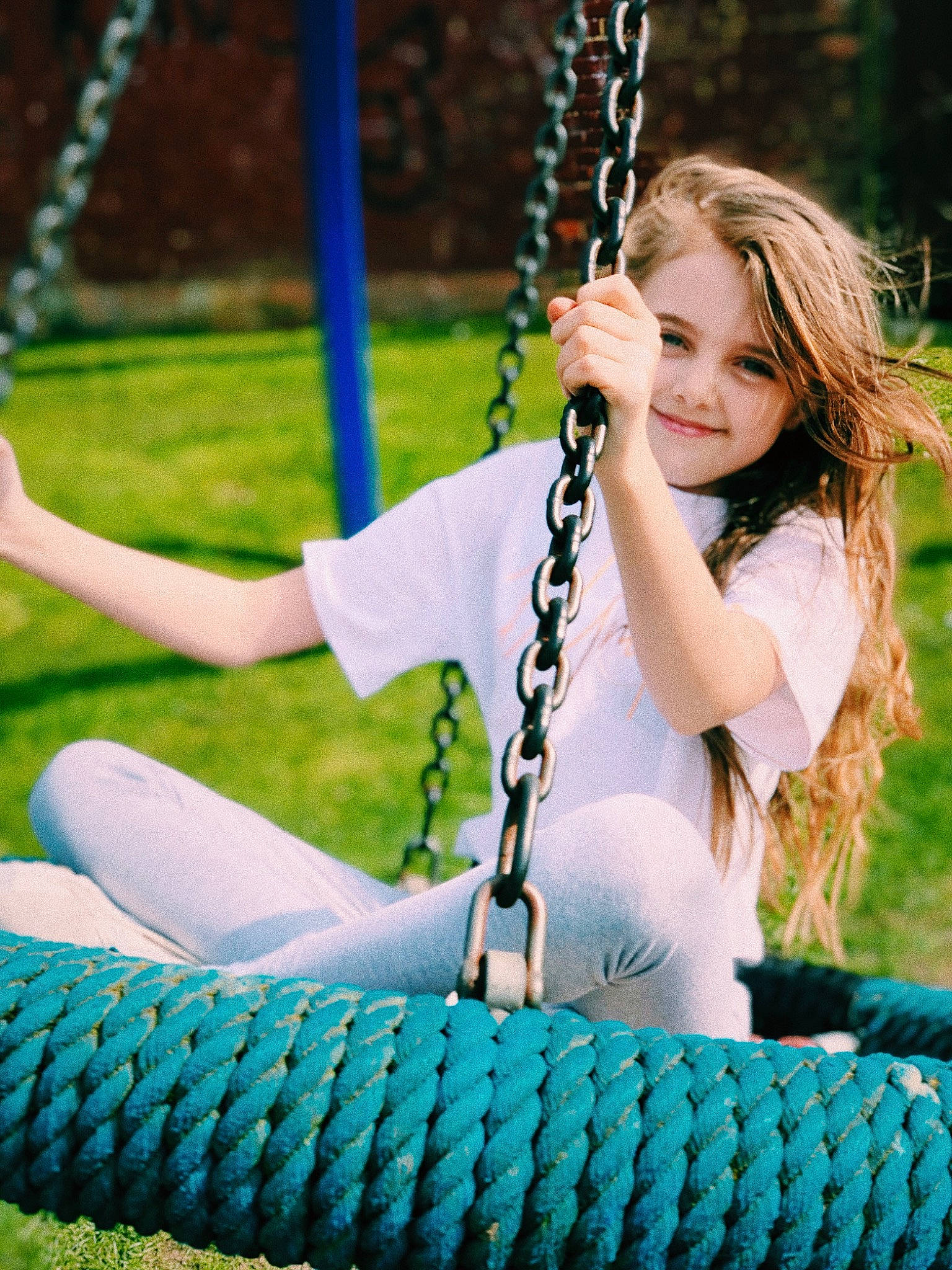 Katie joined the competition — help win amazing prizes! beauty, blond, child, electric_blue, grass, green, joy, lady, leisure, long_hair, necklace, outdoor_play_equipment, person, photo_shoot, photography, playground, public_space, sitting, smile, summer