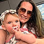 baby, woman, sunglasses, pacifier, headband, outdoor, balcony, man, glass, sky, cloud, railing, portrait, child, person, smile, hair, arm, clothing, window