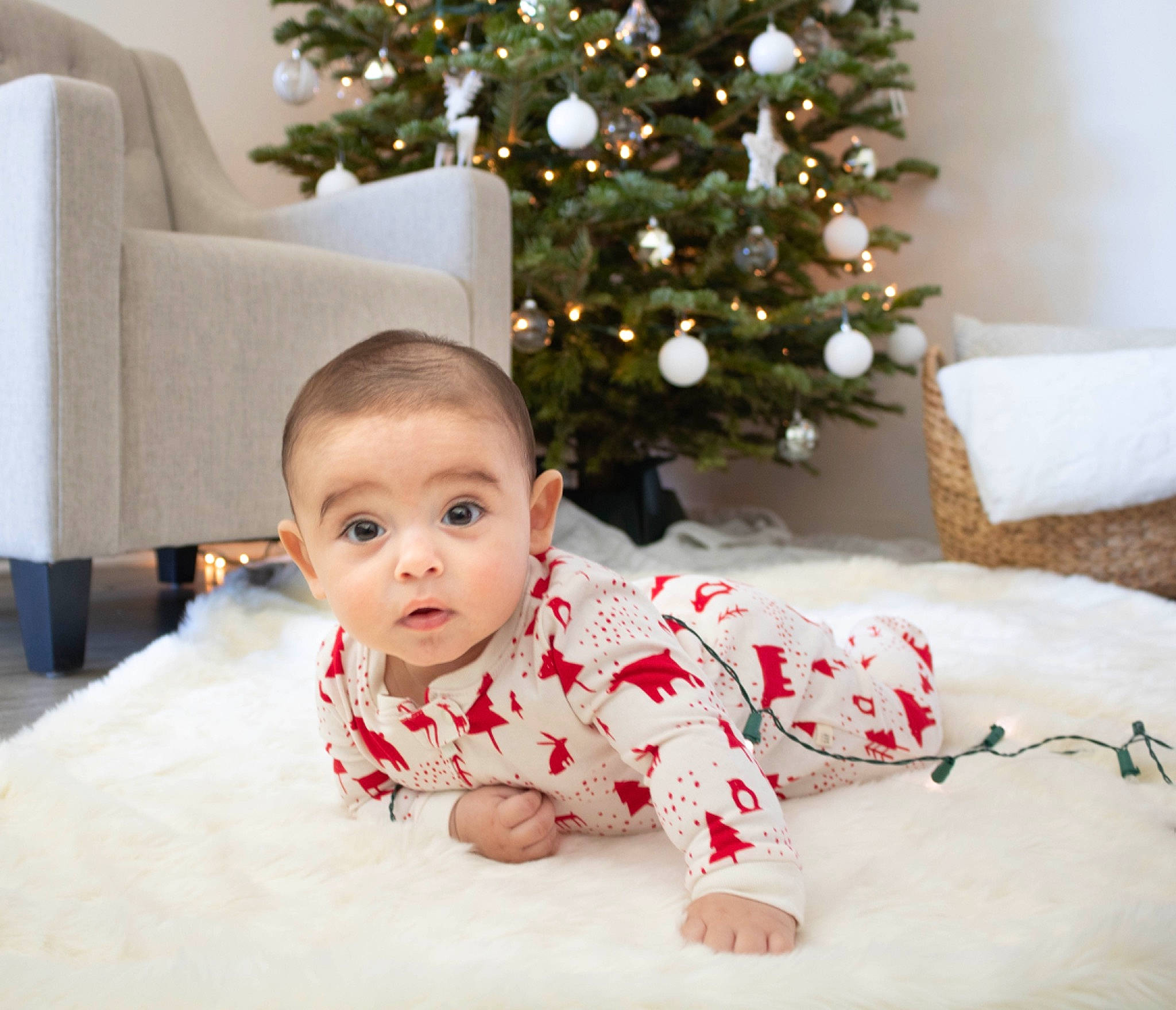 Kamrin is registered to the contest to win money with this photo: child, christmas, christmas_decoration, christmas_ornament, christmas_tree, holiday, infant, person, product, textile, toddler