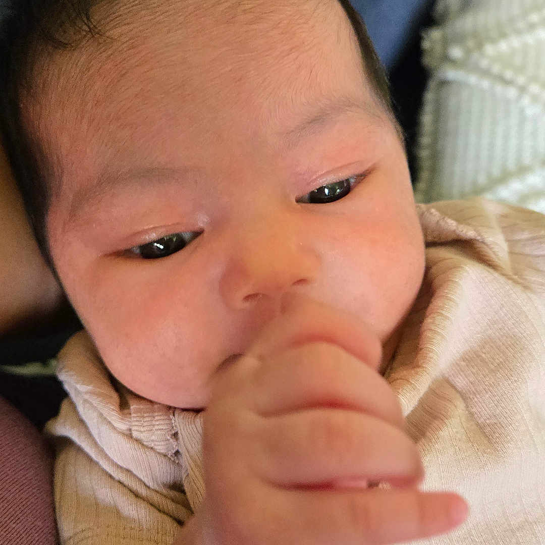 Meria Galena joined the competition — help win amazing prizes! baby, child, closeup, clothing, cozy, cute, eyes, face, hair, hand, indoors, infant, newborn, person, portrait, skin, sleepy, soft, thumb, young