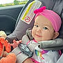 Rhianna joined the competition — help win amazing prizes! baby, infant, car_seat, pink_headband, plush_toy, smiling, child, seatbelt, car_interior, window, nature, greenery, cute, portrait, travel, child_safety, colorful_clothing, closeup, happy, young_child