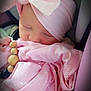 Karma is registered to the contest to win money with this photo: baby, sleeping, pink, blanket, headband, bow, wooden_beads, car_seat, infant, soft_texture, closeup, peaceful, child, cute, wrapped, portrait, adorable, clothing, newborn, resting