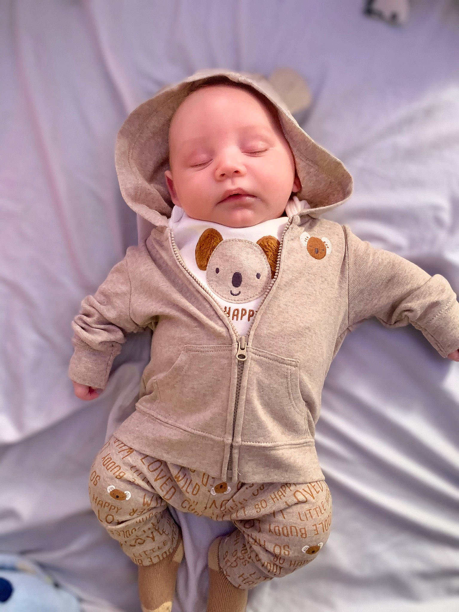 Leo is registered to the contest to win money with this photo: baby, baby_products, baby_toddler_clothing, cheek, child, comfort, fur, headgear, hood, jacket, linens, lip, nose, outerwear, person, room, sitting, skin, sleeve, textile