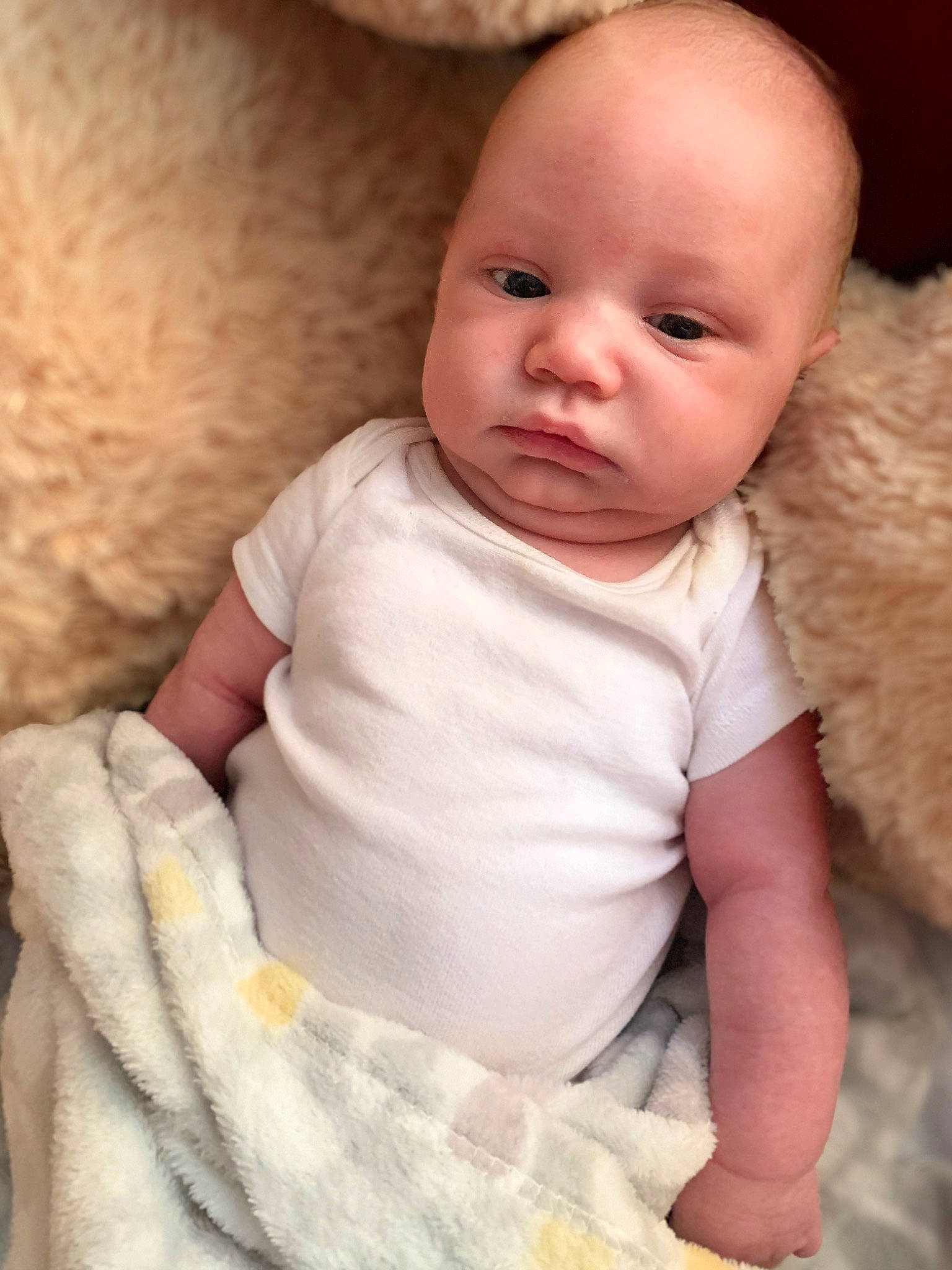 Leo is registered to the contest to win money with this photo: baby, baby_toddler_clothing, cheek, collar, comfort, eye, eyelash, face, finger, happy, head, human_body, iris, linens, lip, nose, person, pink, skin, sleeve