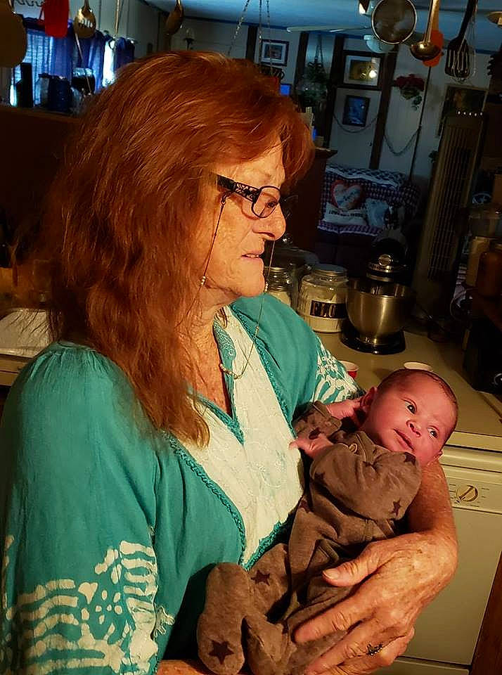 Daxton is registered to the contest to win money with this photo: birth, child, glasses, grandparent, mother, person