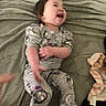 Elizabeth joined the competition — help win amazing prizes! bed, blanket, cartoon_print, child, clothing, comfort, cute, happy, home, indoor, infant, laughing, pajamas, person, playful, relaxed, smiling, soft_fabric, toddler, young_child