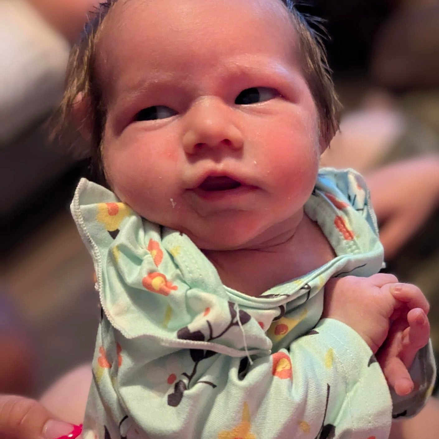 Marie joined the competition — help win amazing prizes! baby, closeup, clothing, curly_hair, cute, expression, face, hand, holding, human, indoor, infant, newborn, onesie, person, pink_nails, portrait, skin, soft_focus, young_child