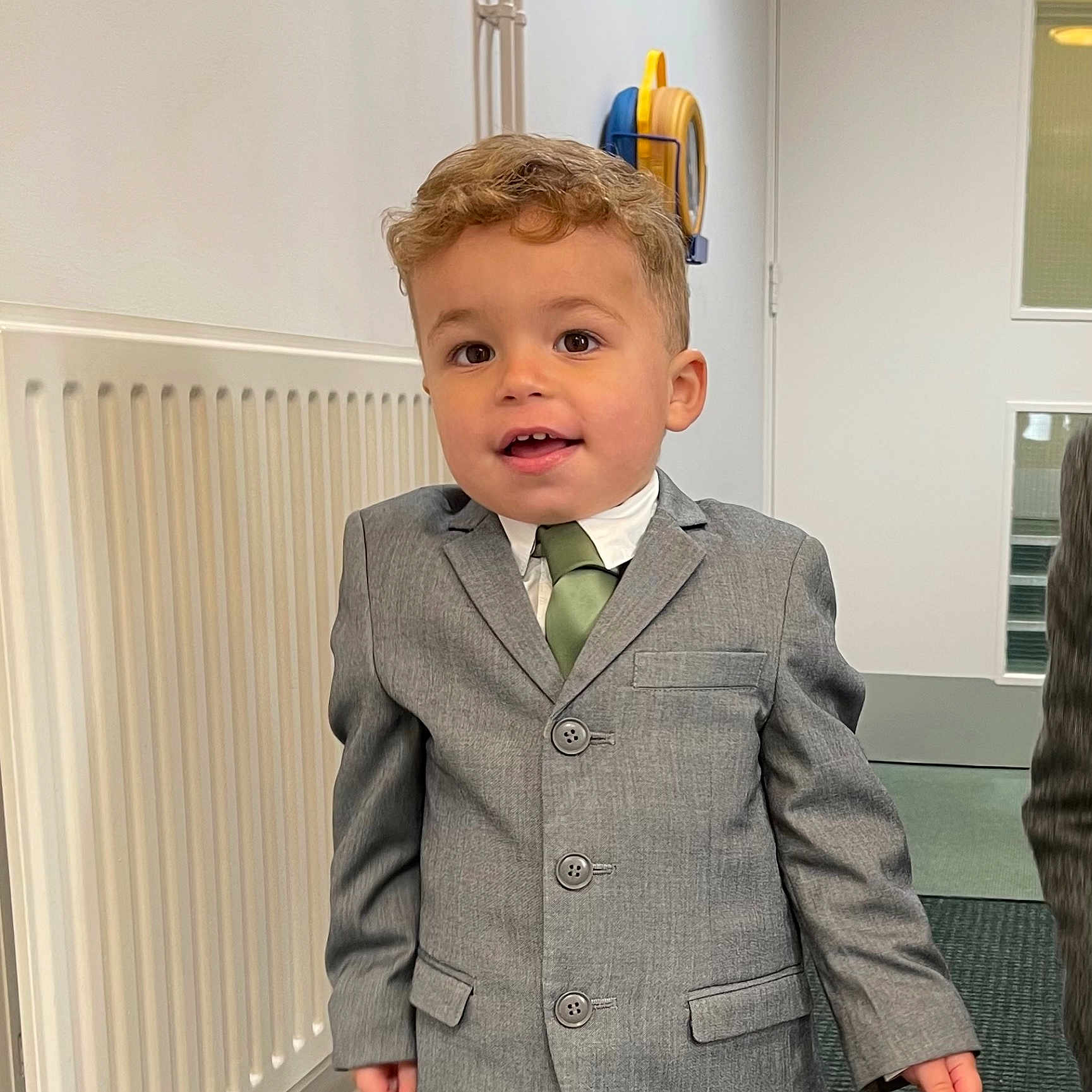 Bodhi is registered to the contest to win money with this photo: accessories, blazer, blonde, boy, brownhair, child, clothing, coat, face, formalwear, hair, head, jacket, male, pants, person, photography, sleeve, suit, tie