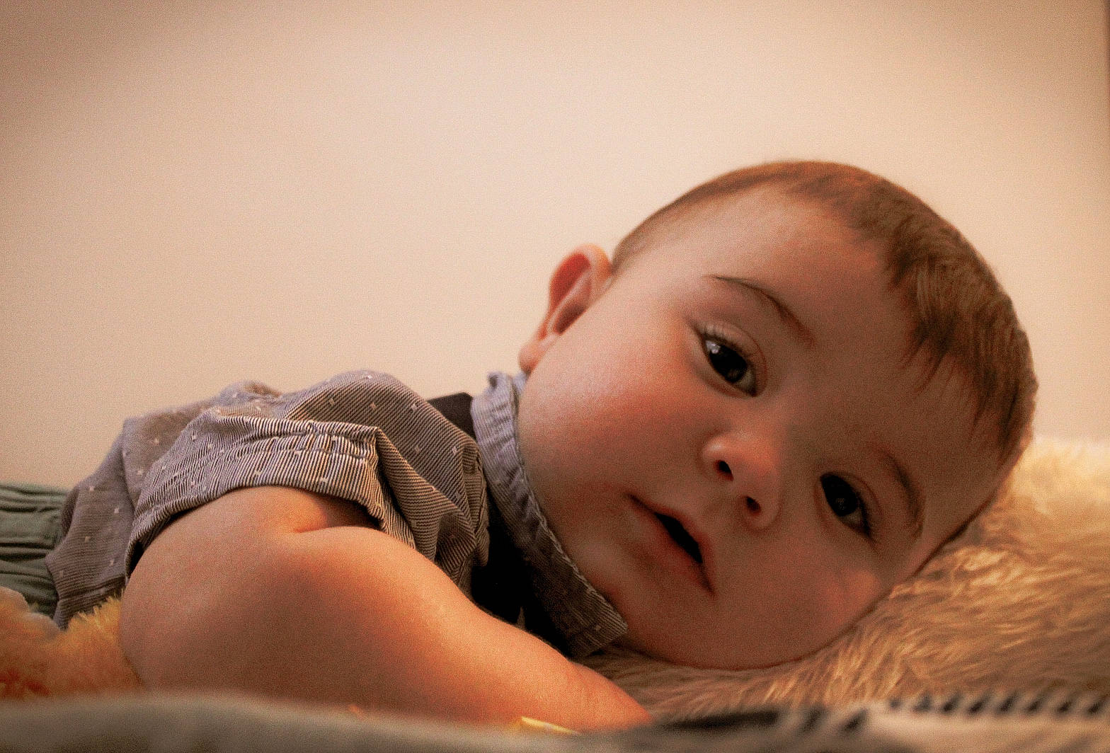 Declan is registered to the contest to win money with this photo: baby, cheek, child, comfort, eye, eyelash, flash_photography, fun, fur, grass, happy, human_leg, iris, lip, mouth, nose, person, sitting, skin, toddler