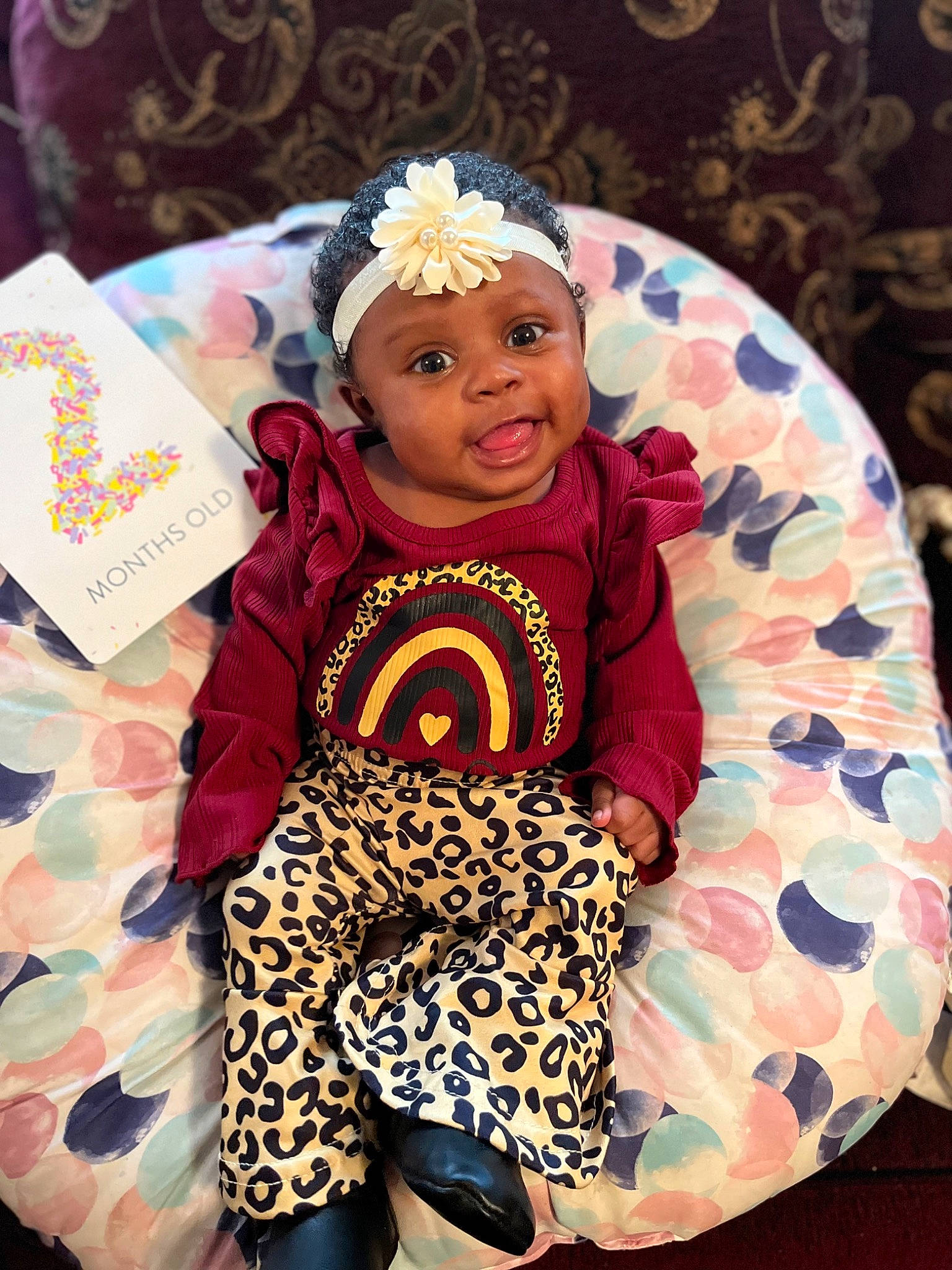 Haley joined the competition — help win amazing prizes! baby, baby_toddler_clothing, chair, child, event, eye, face, fashion_accessory, fun, happy, headwear, jewellery, magenta, pattern, person, pink, sitting, sleeve, smile, t_shirt
