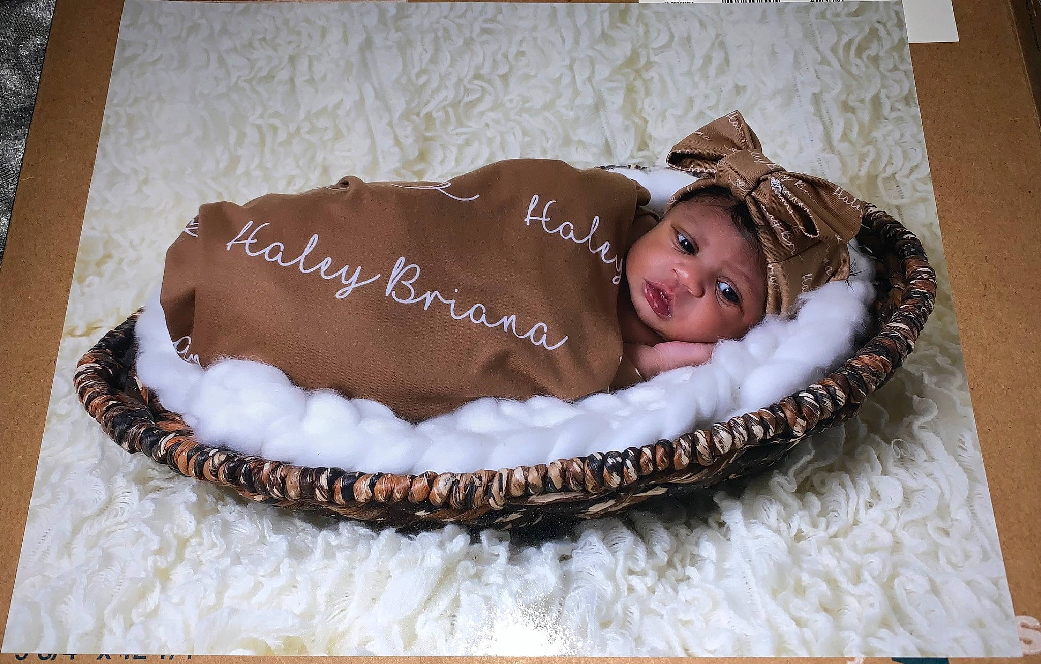 Haley is registered to the contest to win money with this photo: baby, baby_products, baby_toddler_clothing, birthday_cake, brown, child, comfort, fashion_accessory, fur, hair_accessory, headband, headgear, headpiece, headwear, jewellery, linens, pattern, person, room, smile