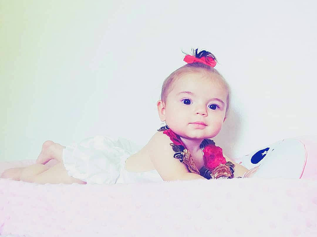 Alesha is registered to the contest to win money with this photo: baby, beauty, cheek, child, ear, eye, face, forehead, hair_accessory, head, headgear, headpiece, lip, nose, person, photography, pink, product, skin, toddler