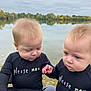 Adèle Et Michèle participe au concours pour gagner de l'argent avec cette photo : baby, infant, toddler, child, holding_hands, matching_outfits, black_clothing, please_mom_text, outdoor, lake, water, reflection, trees, autumn, cloudy_sky, grass, nature, portrait, cute, together