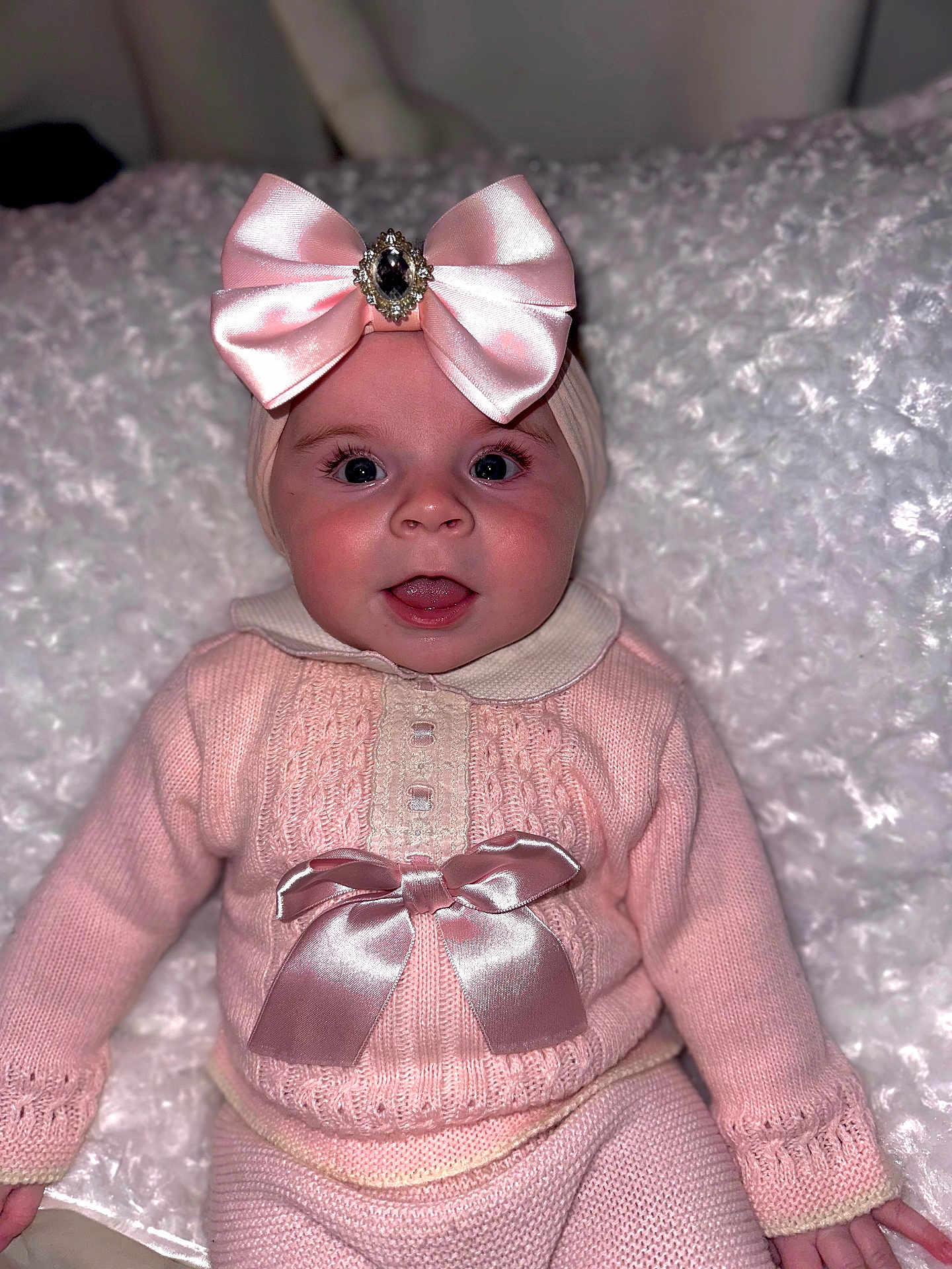 Esmée joined the competition — help win amazing prizes! baby, child, pink_bow, headband, knitwear, sweater, pants, blanket, fluffy, cute, face, smiling, indoor, portrait, infant, apparel, fashion, happy, person, closeup