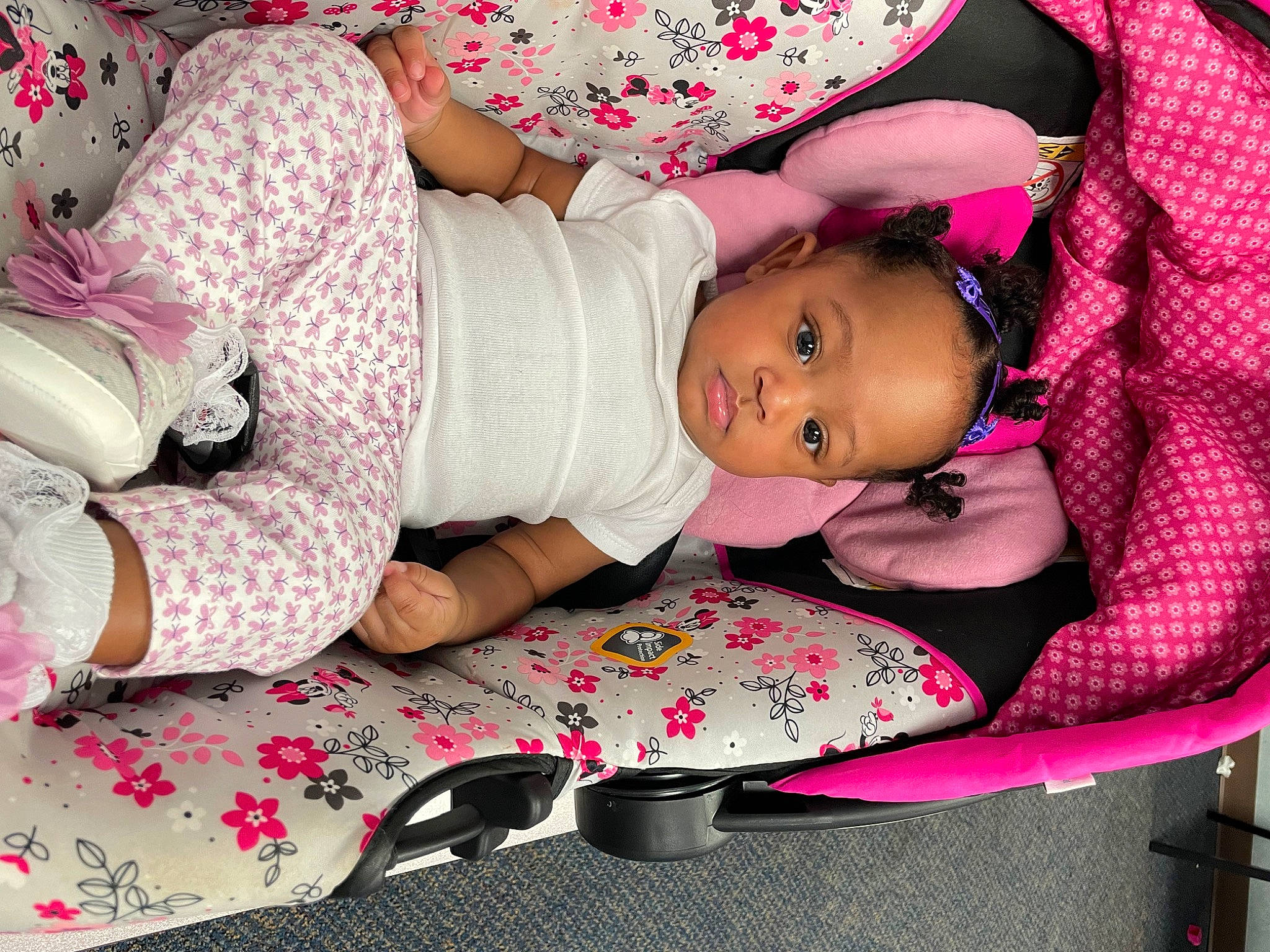 Tori is registered to the contest to win money with this photo: arm, baby, baby_products, baby_toddler_clothing, child, comfort, happy, hat, lap, leg, magenta, pattern, person, pink, red, skin, sleeve, textile, thigh, toddler