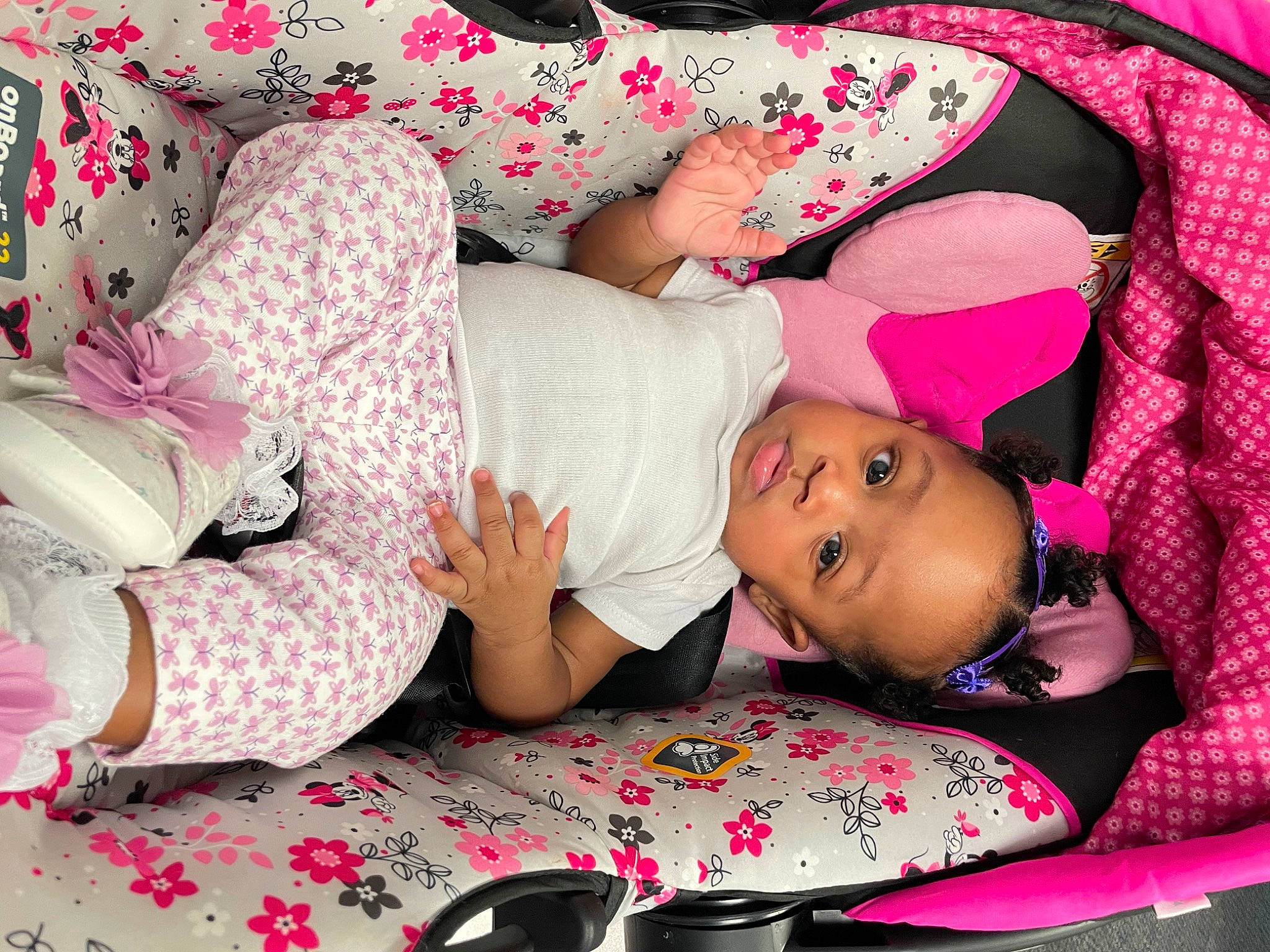 Tori is registered to the contest to win money with this photo: baby_toddler_clothing, carmine, child, comfort, happy, hat, human_body, human_leg, linens, lip, magenta, pattern, person, pink, red, sitting, skin, sleeve, textile, thigh