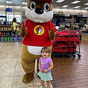 Vivienne joined the competition — help win amazing prizes! child, toddler, mascot, costume, store, grocery_store, shopping_cart, shopping_carts, smile, happy, retail_shelves, tile_floor, wood_floor, ceiling_lights, red_shirt, purple_shirt, logo, character, public_space, family_outing