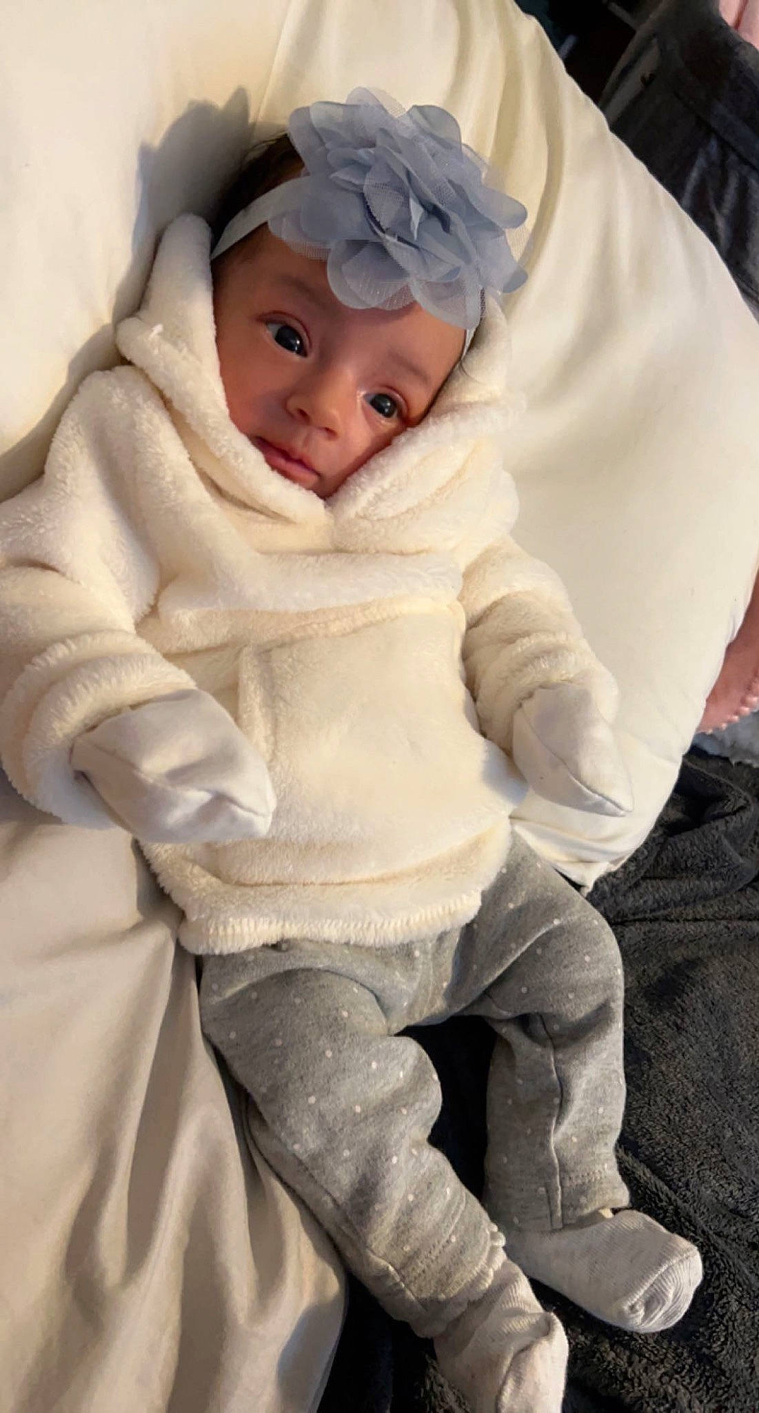 Leilani joined the competition — help win amazing prizes! baby, baby_products, baby_toddler_clothing, beanie, cap, cheek, child, comfort, eye, fashion_accessory, fur, head, headwear, hood, linens, person, sitting, skin, sleeve, smile